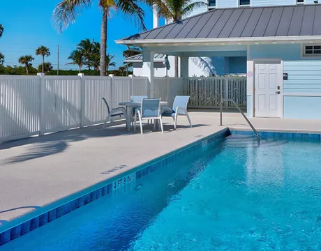 Pool and pool deck with chairs
