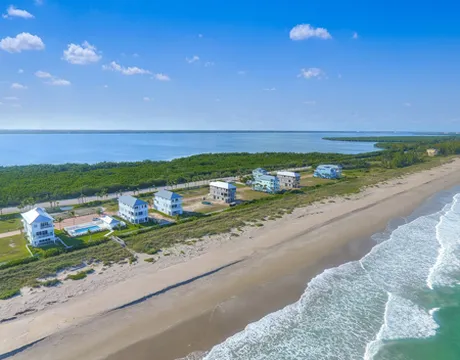 Aerial view of custom homes along the beach